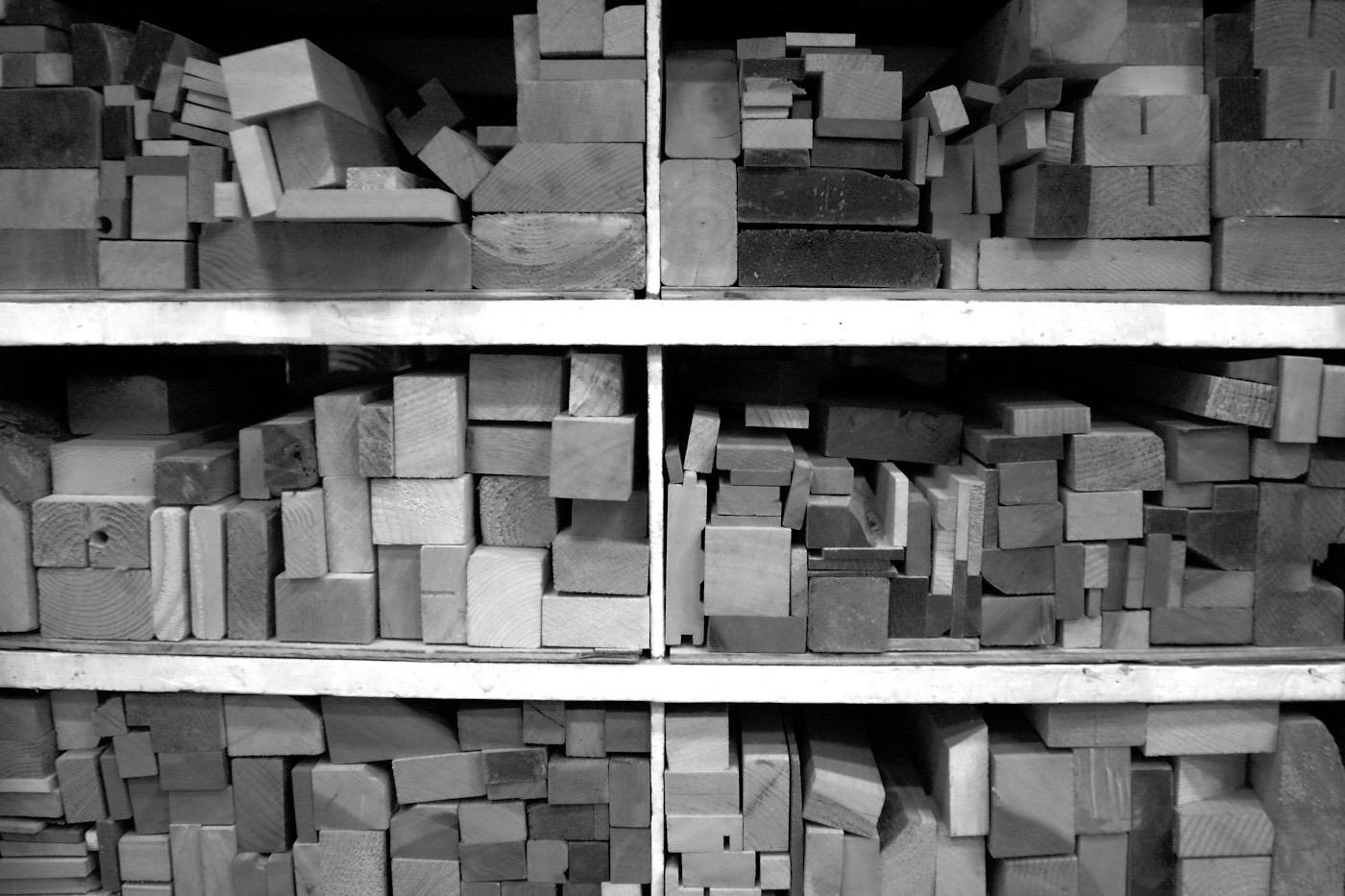 Wooden blocks stacked on storage shelves